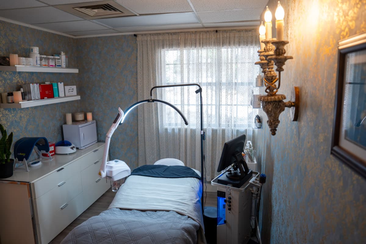 Professional facial treatment bed in the HydraFacial room at LNO Boutique med spa in Centennial, CO