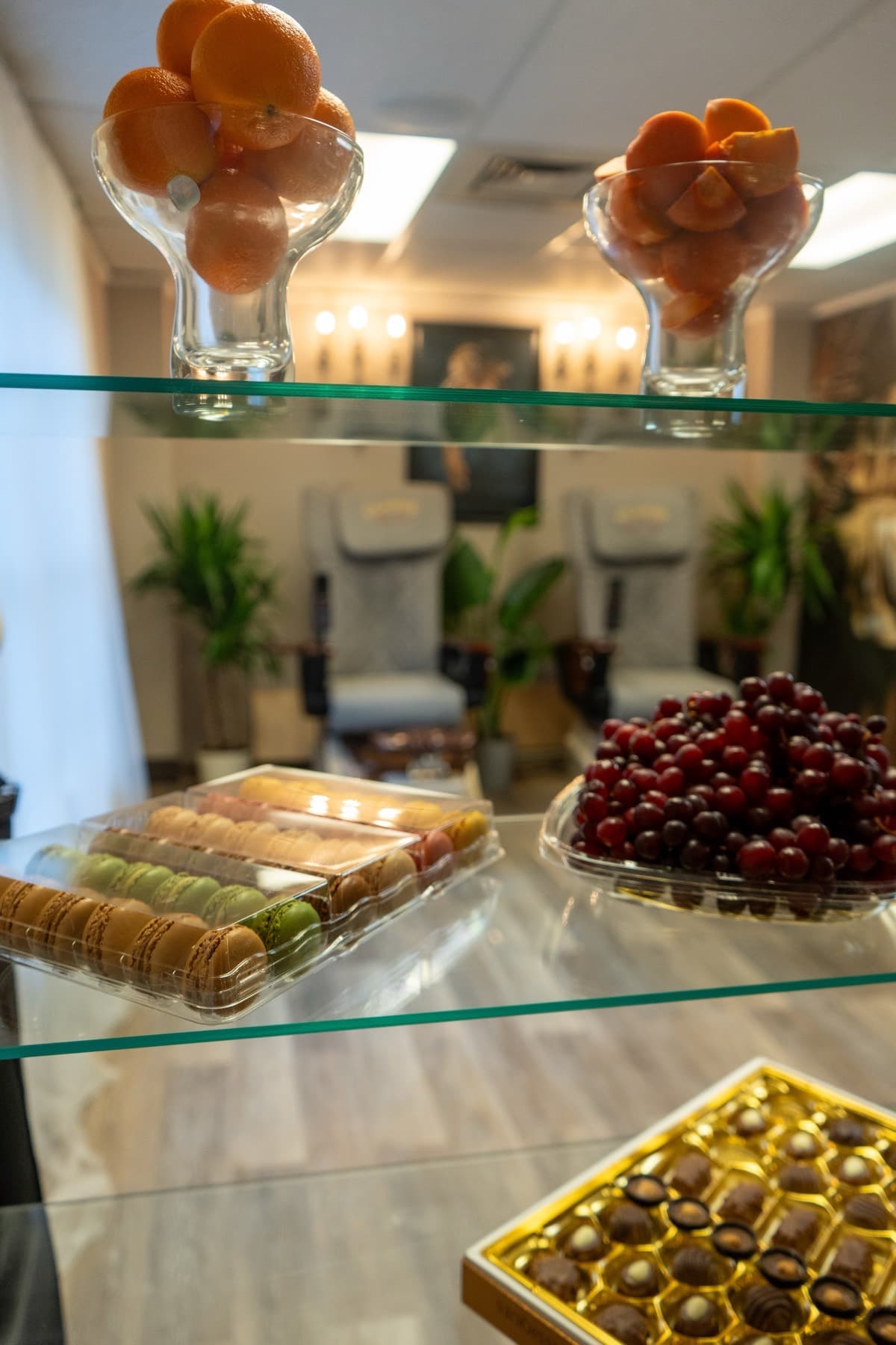 Macarons and grapes laid out for a spa day at LNO Boutique in Centennial, Colorado