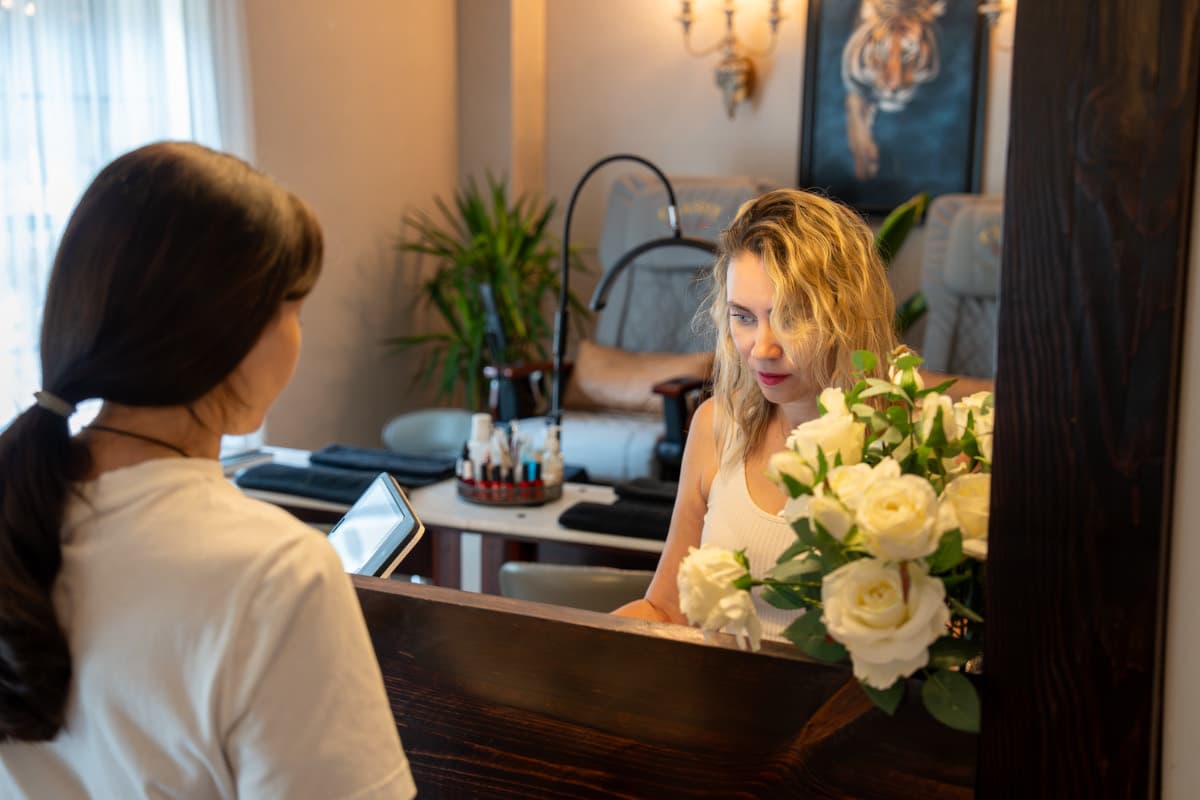 Guest seated at the vanity for a med spa consultation at LNO Boutique in Centennial, Denver area