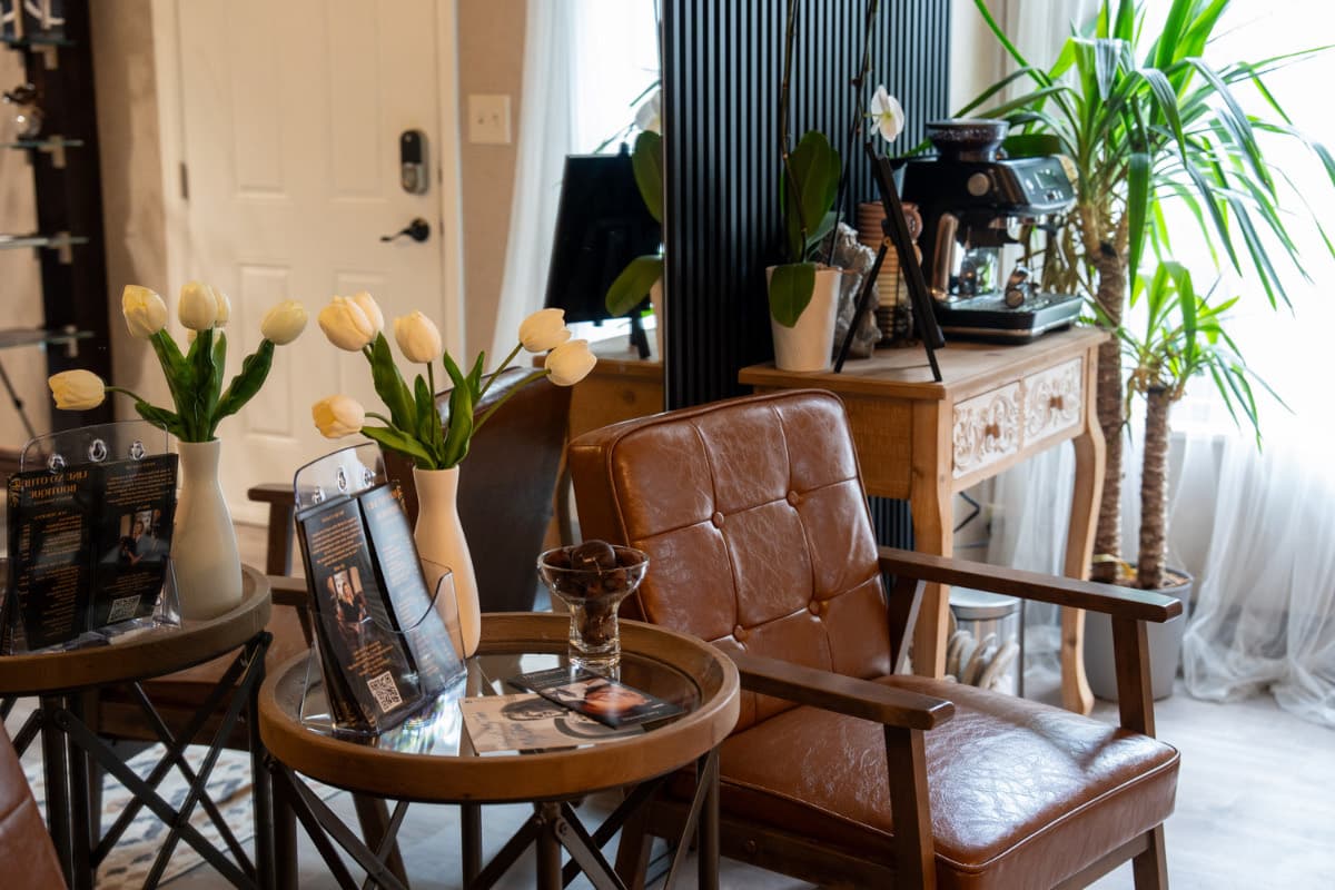 Reception lounge with fresh tulips and leather seating at LNO Boutique day spa in Centennial, CO