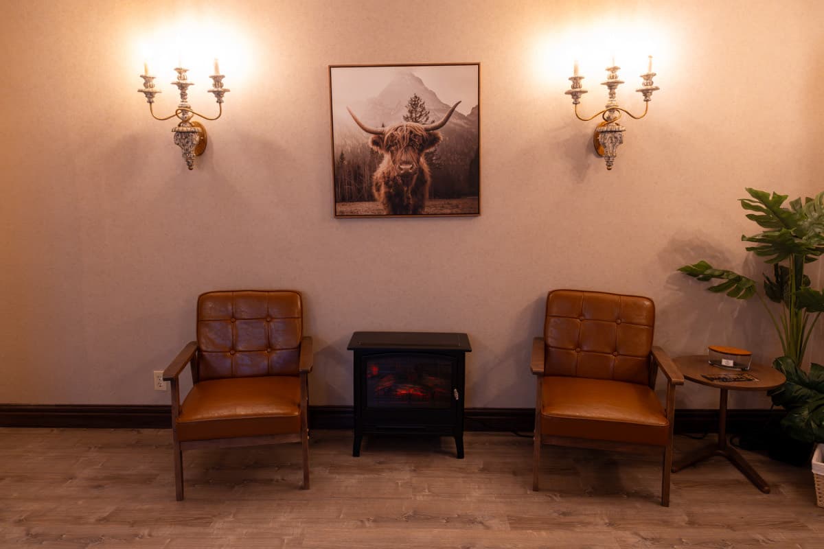 Cozy relaxation lounge with a fireplace at LNO Boutique day spa in Centennial, Colorado